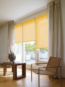 yellow roller blinds with curtains in living room