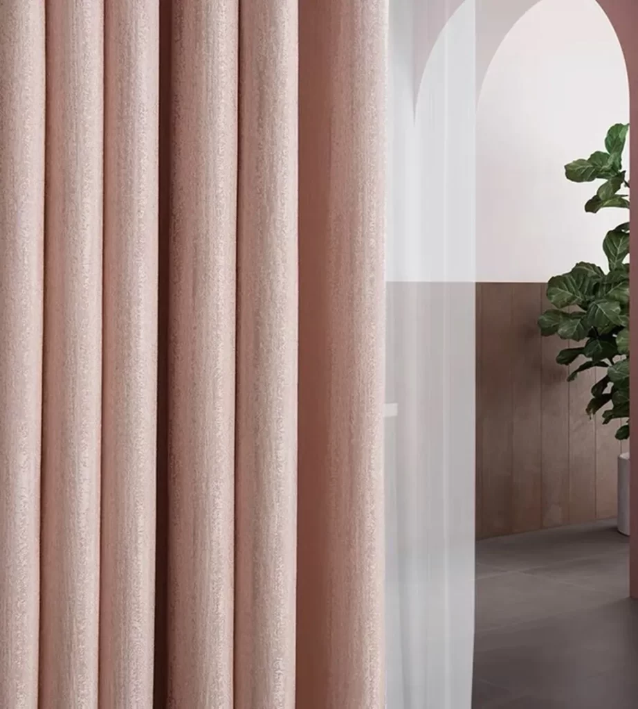 pink salmon curtain as a room divider 