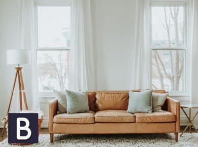 white sheer curtains behind leather couch